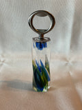 Very unique bottle opener with recycled wine bottle glass embedded in handle.  Our profit goes to animal rescue!
