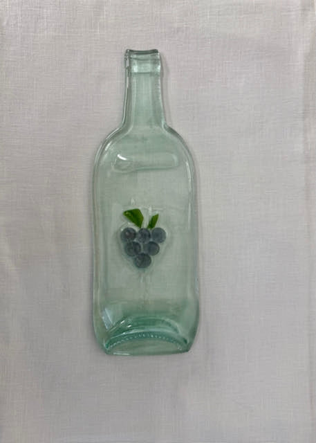 Clear slumped wine bottle platter with embedded glass image of grapes