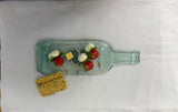 Clear slumped wine bottle platter with embedded glass image of grapes