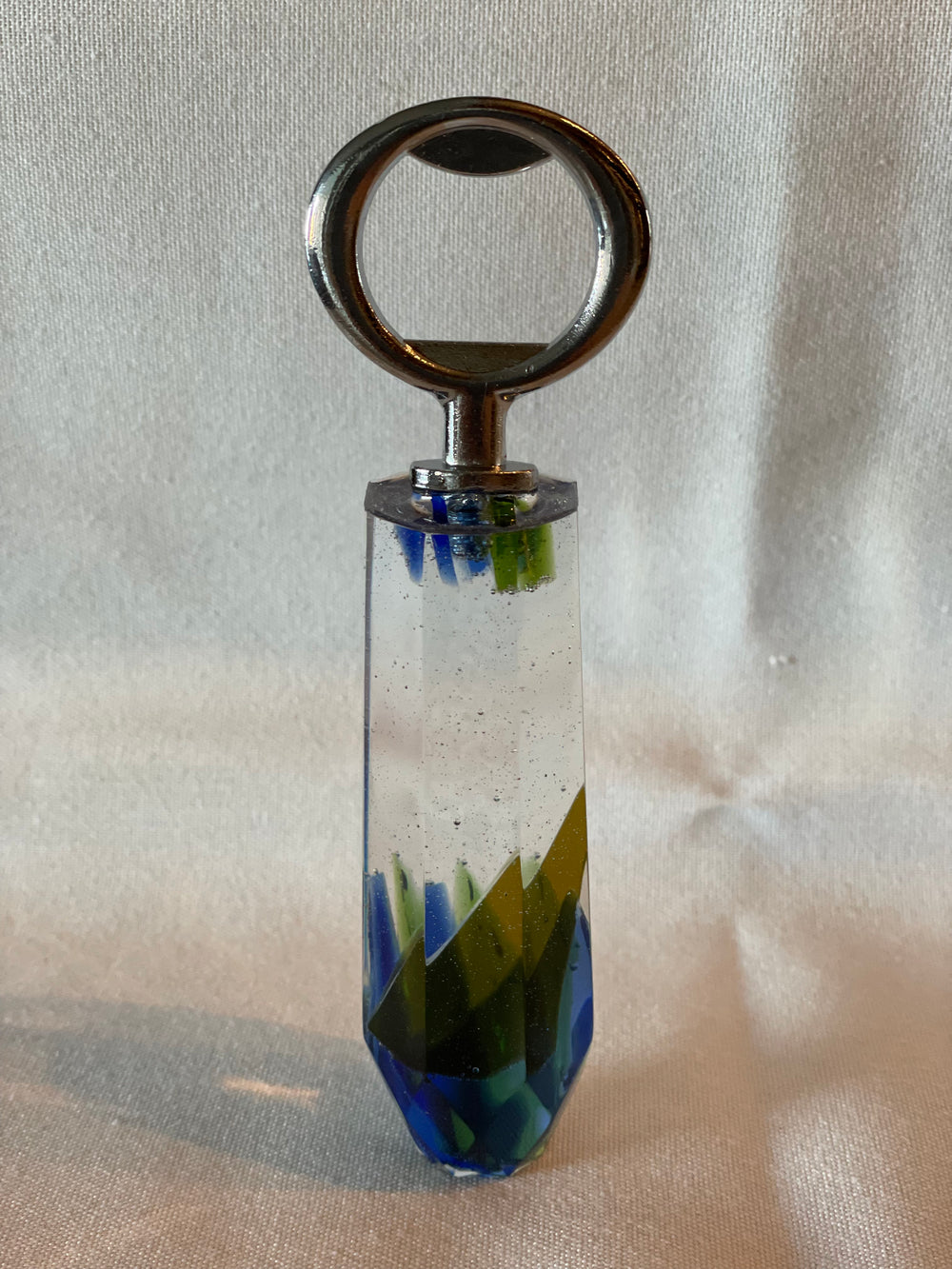 Resin bottle opener embedded with recycled wine bottle glass