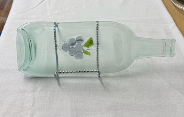 Clear slumped wine bottle platter with embedded glass image of grapes