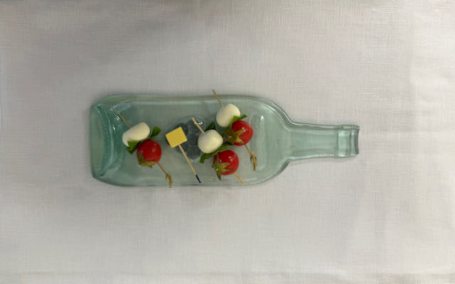 Clear slumped wine bottle platter with embedded glass image of grapes