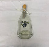 Clear slumped wine bottle platter with image of grapes