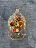 Slumped Elijah Craig bourbon bottle