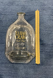 Slumped Elijah Craig bourbon bottle