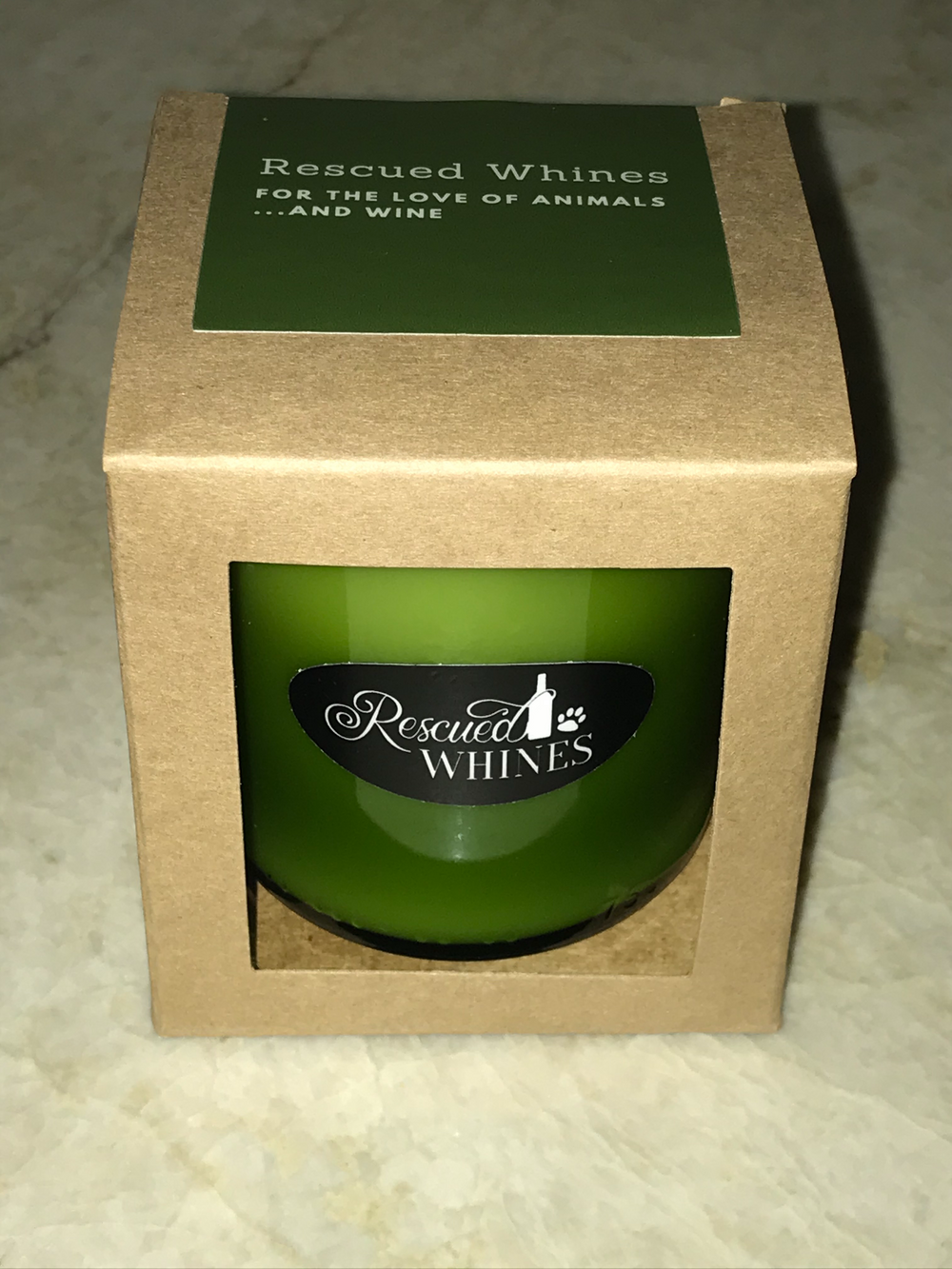 Recycled green wine bottle candle with embedded paw print