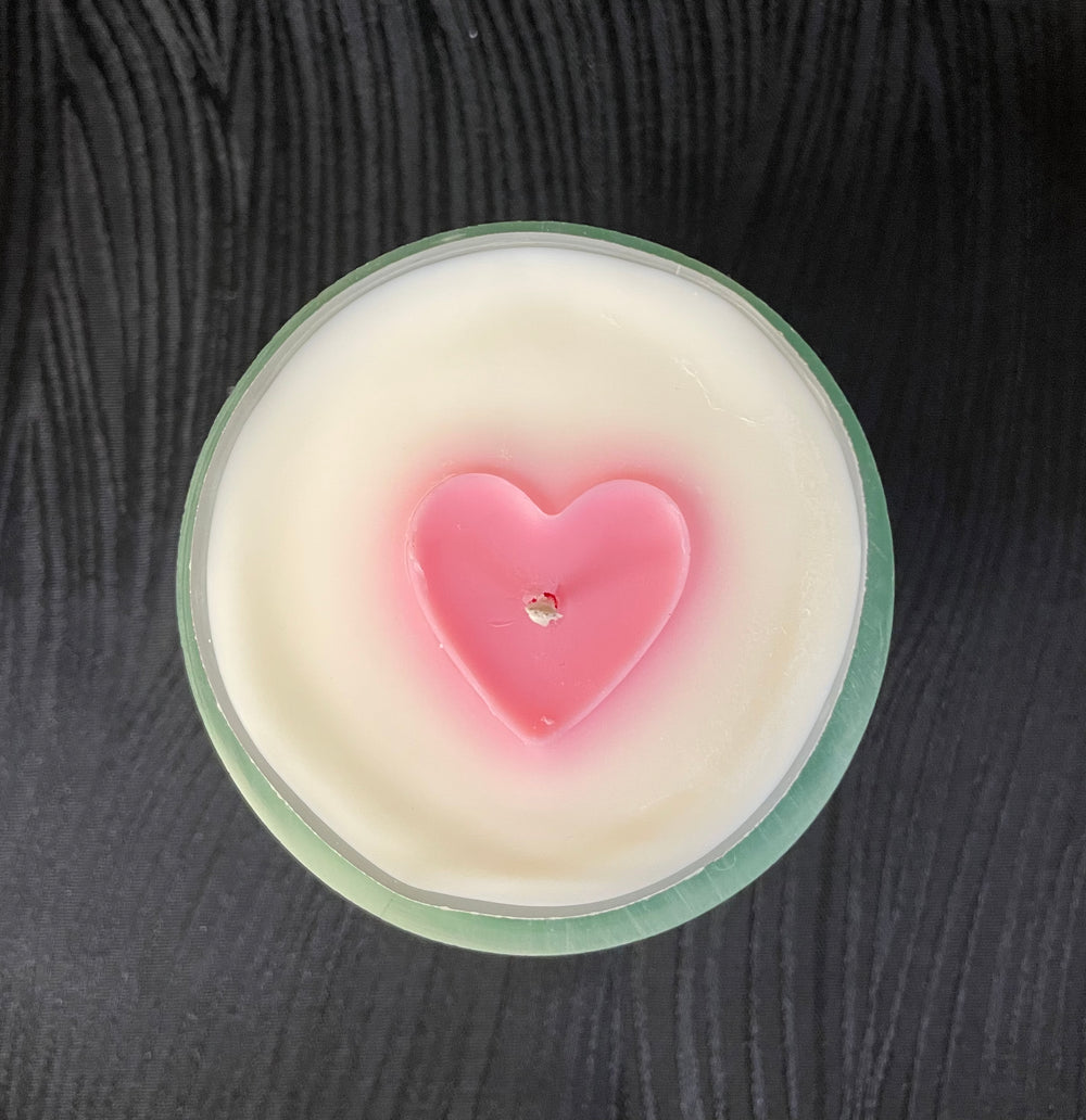 Recycled wine bottle candle with embedded heart