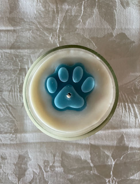 soy wax candle made from recycled wine bottle.  Profit goes to animal rescue.