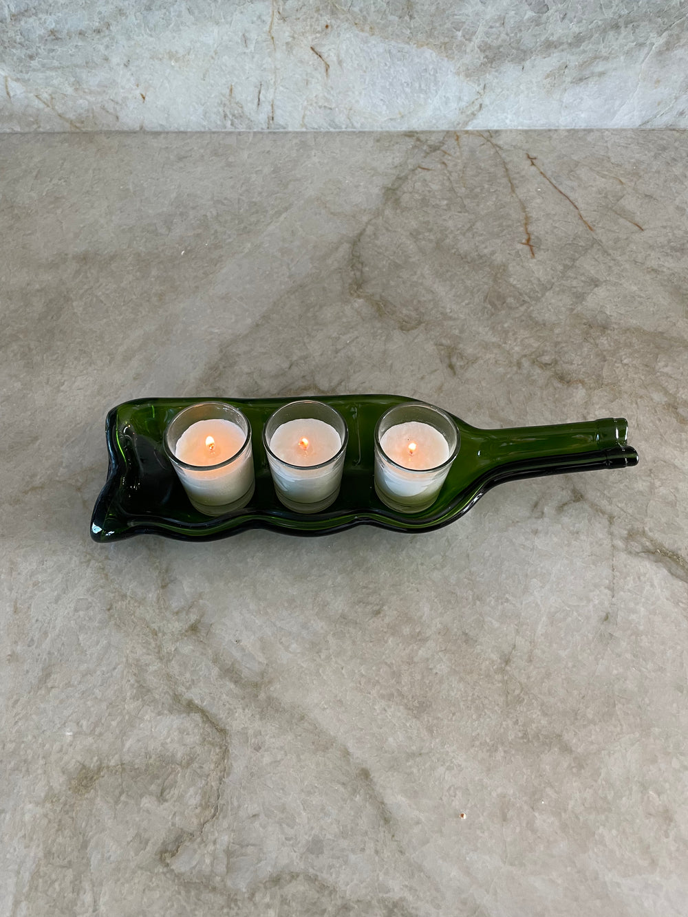 Slumped wine bottle candle holder. Rescued Whines