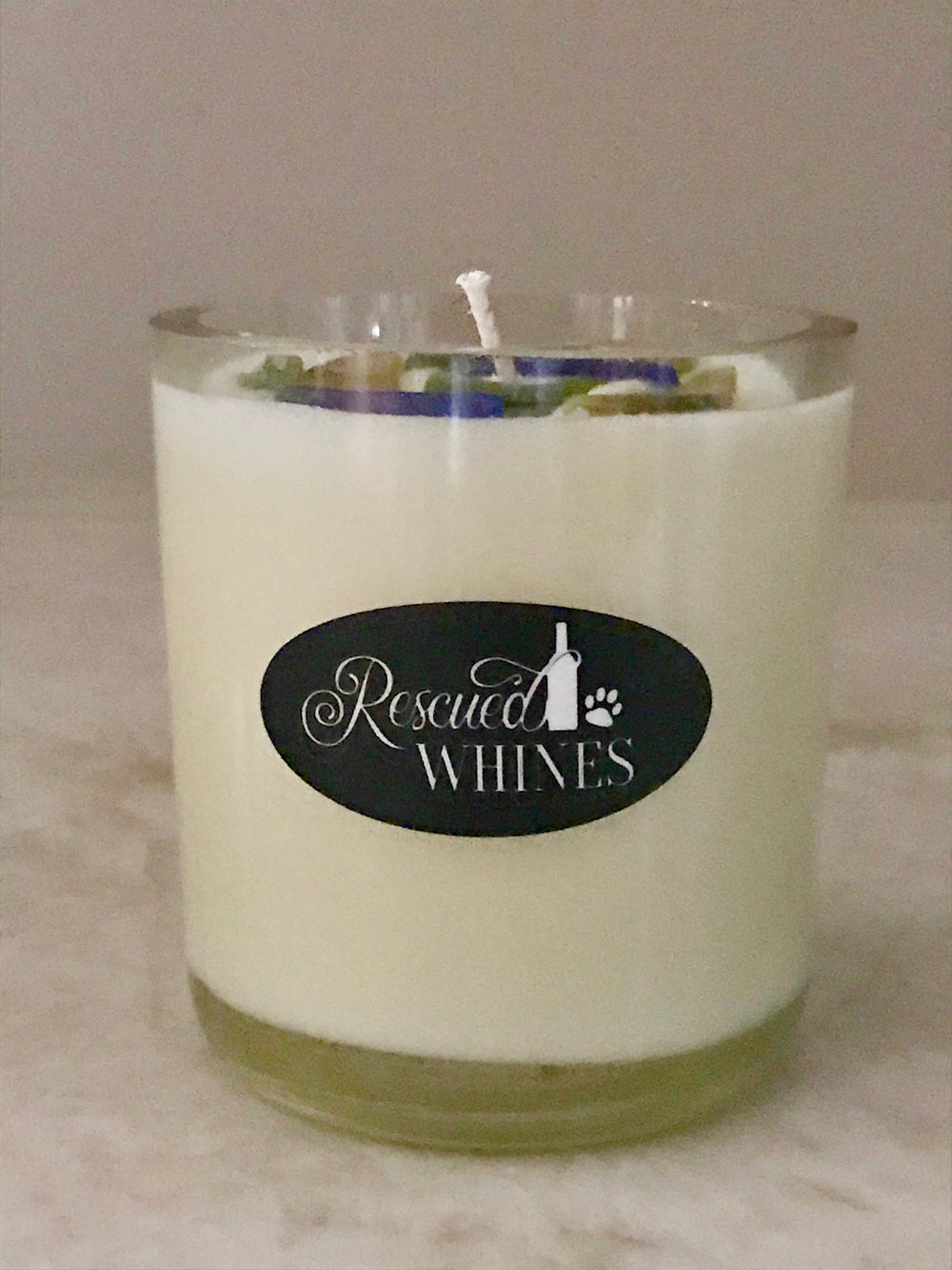 Soy wax wine bottle candle with recycled wine bottle chips embedded on top.  Profit goes to animal rescue!